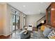 Bright living room featuring large windows, a modern staircase, and contemporary furnishings at 3195 Blake St # 106, Denver, CO 80205