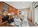 Well-lit living room with a wood accent wall, modern furniture, and neutral color palette at 3195 Blake St # 106, Denver, CO 80205