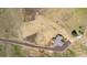 Aerial view showing home, expansive lot, and outbuildings at 8408 Vinegarroon Rd, Parker, CO 80138
