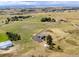 Aerial view of house, expansive lot, and distant mountain views at 8408 Vinegarroon Rd, Parker, CO 80138