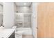 Clean bathroom with tub, shower, and modern vanity at 8408 Vinegarroon Rd, Parker, CO 80138