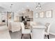 Kitchen dining area with round glass table and four beige chairs at 8408 Vinegarroon Rd, Parker, CO 80138