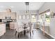 Kitchen dining area with round glass table and four chairs at 8408 Vinegarroon Rd, Parker, CO 80138