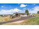House exterior featuring a deck, landscaping, and a spacious driveway at 8408 Vinegarroon Rd, Parker, CO 80138