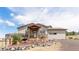 Ranch style home with stone accents, deck, and mountain views at 8408 Vinegarroon Rd, Parker, CO 80138