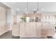 Modern kitchen with light wood cabinets and stainless steel appliances at 8408 Vinegarroon Rd, Parker, CO 80138