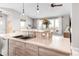 Kitchen island with double sink, breakfast bar, and seating at 8408 Vinegarroon Rd, Parker, CO 80138