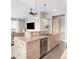 Modern kitchen with light wood cabinets and stainless steel appliances at 8408 Vinegarroon Rd, Parker, CO 80138