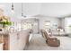 Open concept living room with large windows and comfortable seating at 8408 Vinegarroon Rd, Parker, CO 80138