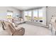 Relaxing living room with large windows and a sectional sofa at 8408 Vinegarroon Rd, Parker, CO 80138