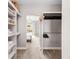 Large walk-in closet with shelving and hanging rods at 8408 Vinegarroon Rd, Parker, CO 80138