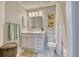Bright bathroom with a white vanity, neutral paint, and a shower with a curtain at 1811 S Quebec Way # 103, Denver, CO 80231