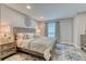 Serene bedroom featuring a king-size bed, soft lighting, and stylish decor at 1811 S Quebec Way # 103, Denver, CO 80231