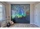 Bedroom features a window and artistic closet doors at 1811 S Quebec Way # 103, Denver, CO 80231