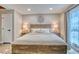 Comfortable bedroom with neutral colors, a king-sized bed, and ample natural light at 1811 S Quebec Way # 103, Denver, CO 80231