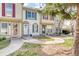 Charming townhome exterior with well-maintained landscaping and a welcoming entrance at 1811 S Quebec Way # 103, Denver, CO 80231