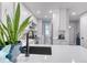 Contemporary kitchen with white cabinetry, stainless steel appliances, and modern fixtures at 1811 S Quebec Way # 103, Denver, CO 80231