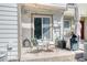 Outdoor patio area with seating, grill, and privacy from neighboring units at 1811 S Quebec Way # 103, Denver, CO 80231