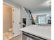 Cozy powder room with modern fixtures, a white vanity, and decorative flooring at 1811 S Quebec Way # 103, Denver, CO 80231