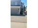 Charming two-story townhome with a gray garage and well-maintained landscaping, located in a desirable community at 12592 E Cornell Cir, Aurora, CO 80014