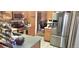Bright kitchen with stainless steel appliances and plenty of cabinet storage at 12592 E Cornell Cir, Aurora, CO 80014