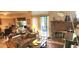 Inviting living room with fireplace and sliding door access to outdoor space at 12592 E Cornell Cir, Aurora, CO 80014