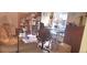 Home office featuring built in shelving, desk and comfortable seating area at 12592 E Cornell Cir, Aurora, CO 80014