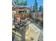 Inviting outdoor patio with comfortable seating, shade umbrella, and decorative accents for relaxed outdoor living at 12592 E Cornell Cir, Aurora, CO 80014