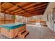 Cozy back porch featuring a hot tub, wood beams, and a lattice wall at 1056 S Macon Way, Aurora, CO 80012