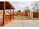 Backyard featuring a spacious covered patio and a practical storage shed, perfect for outdoor organization at 1056 S Macon Way, Aurora, CO 80012