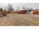 The backyard has a large open space, a shed for storage, and covered patio. Great for relaxing outdoors at 1056 S Macon Way, Aurora, CO 80012