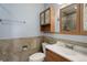 Bathroom featuring a toilet, sink, and vintage cabinet at 1056 S Macon Way, Aurora, CO 80012
