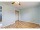 This bedroom features hardwood floors, a closet, and neutral paint at 1056 S Macon Way, Aurora, CO 80012