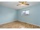 This bedroom features hardwood floors, a ceiling fan, and a window at 1056 S Macon Way, Aurora, CO 80012