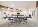 Finished basement featuring a ping pong table, exercise equipment, and comfortable seating area at 8102 S Carr Ct, Littleton, CO 80128