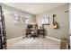 Bedroom featuring a desk, chair, and guitar hanging on the wall; ideal for study or creative pursuits at 8102 S Carr Ct, Littleton, CO 80128