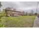 Large backyard with a patio, hot tub, and plenty of green space at 8102 S Carr Ct, Littleton, CO 80128