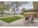 Cozy front porch with seating area overlooking the landscaped yard and neighborhood street at 8102 S Carr Ct, Littleton, CO 80128