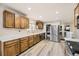 Spacious kitchen with updated appliances, white countertops, and ample cabinet space at 8102 S Carr Ct, Littleton, CO 80128