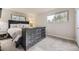 Comfortable bedroom featuring a bed with nightstands and dresser for storage at 8102 S Carr Ct, Littleton, CO 80128