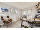 Home office with a desk, chair, and plenty of natural light from the windows at 8102 S Carr Ct, Littleton, CO 80128