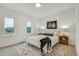 Secondary bedroom with a cozy bed, neutral decor, and natural light at 9055 Westminster Blvd, Westminster, CO 80031