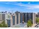 Apartment complex with a beautiful view of the Denver skyline on a sunny day. Reserved parking at 601 W 11Th Ave # 1101, Denver, CO 80204
