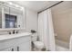 Bright bathroom with a shower/tub combo and neutral color scheme at 601 W 11Th Ave # 1101, Denver, CO 80204