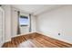 Bedroom with hardwood flooring and a window that overlooks a city at 601 W 11Th Ave # 1101, Denver, CO 80204