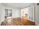 Spacious bedroom with hardwood floors and glass doors leading to another room at 601 W 11Th Ave # 1101, Denver, CO 80204