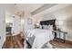 Cozy bedroom with a tufted headboard, plush bedding, and a modern side table with lamps at 601 W 11Th Ave # 1101, Denver, CO 80204
