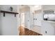 Bright hallway with wood floors, white walls, and access to the bathroom and kitchen at 601 W 11Th Ave # 1101, Denver, CO 80204