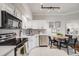 Modern kitchen with stainless steel appliances, white cabinets, and subway tile backsplash at 601 W 11Th Ave # 1101, Denver, CO 80204