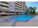 Inviting outdoor pool area with ample seating and a clear view of the residential building at 601 W 11Th Ave # 1101, Denver, CO 80204